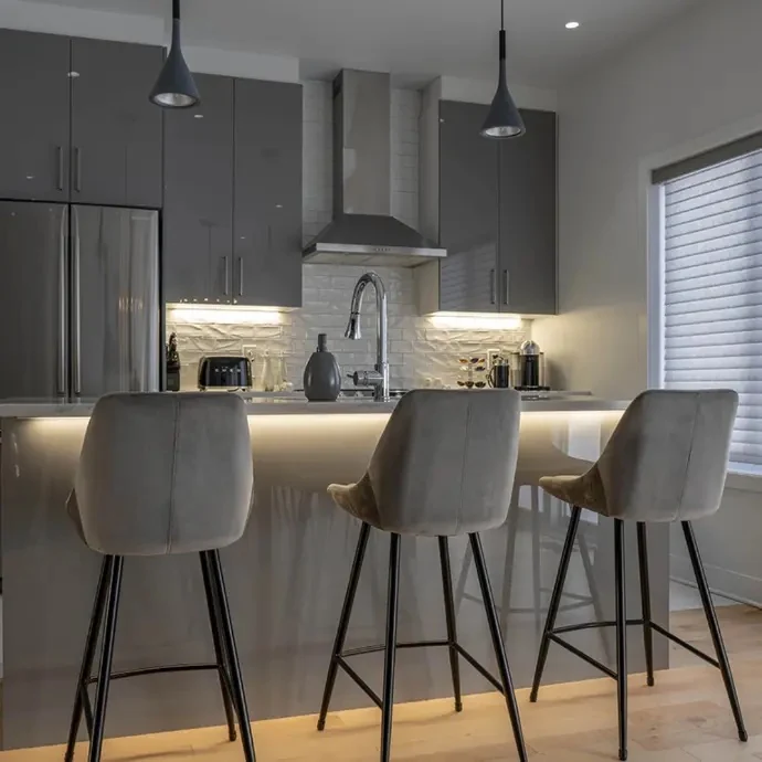 Residential kitchen with layered architectural lighting