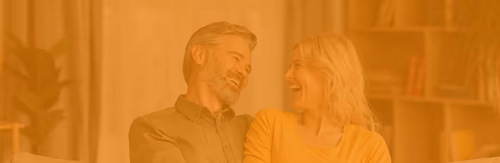 Smiling middle-aged couple at home