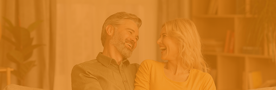 Smiling middle-aged couple at home