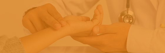 Doctor checking a patient's pulse