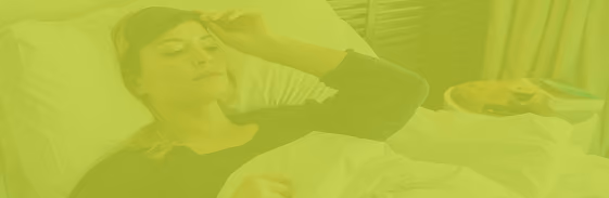 Woman resting in bed — sleep and recovery