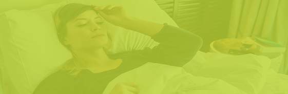 Woman resting in bed — sleep and recovery