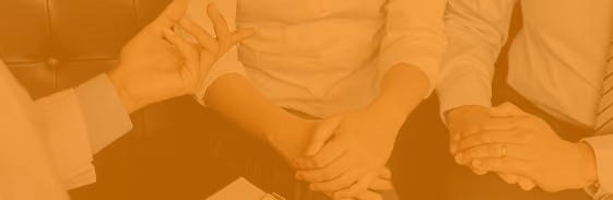 Three people sitting close in a supportive moment