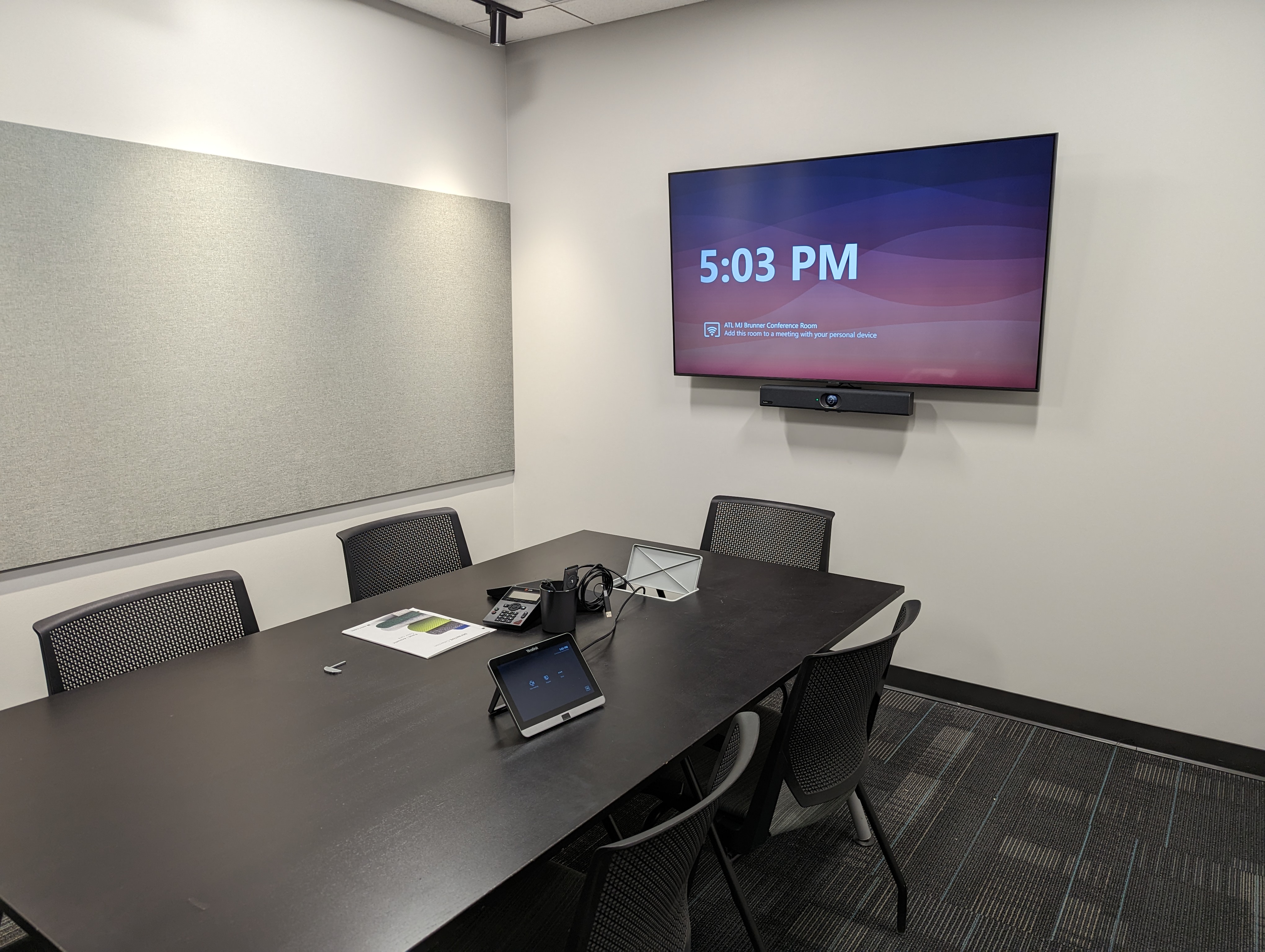 Brunner conference room with Yealink touch console, display, and video bar