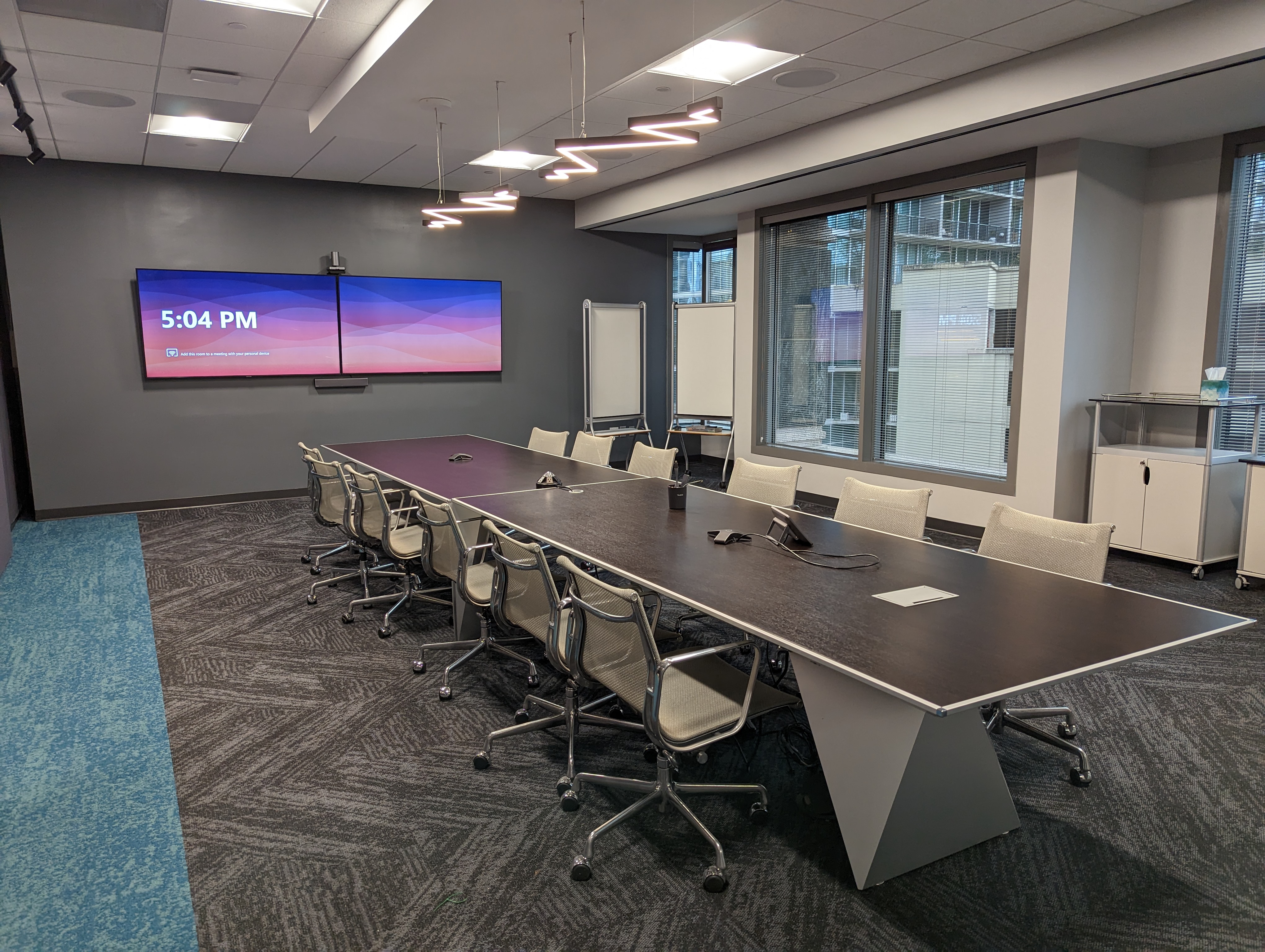 Brunner large conference room with dual displays and an integrated Yealink Microsoft Teams Rooms system