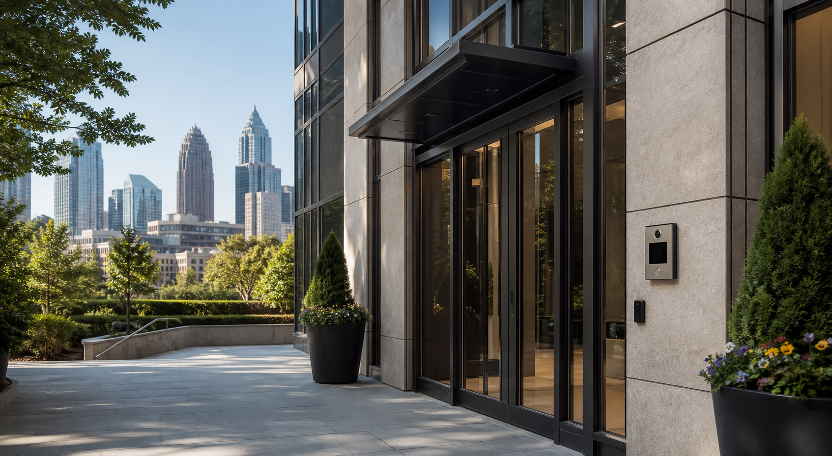 Modern Midtown Atlanta office entrance with a video intercom and access-control card reader