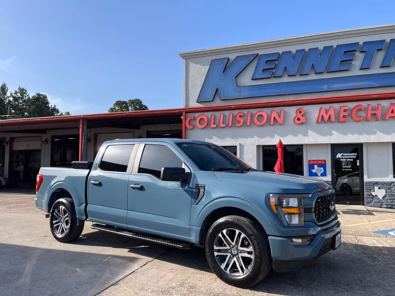 Kenneth's Car Care team in front of the Kingwood, TX collision & mechanical shop