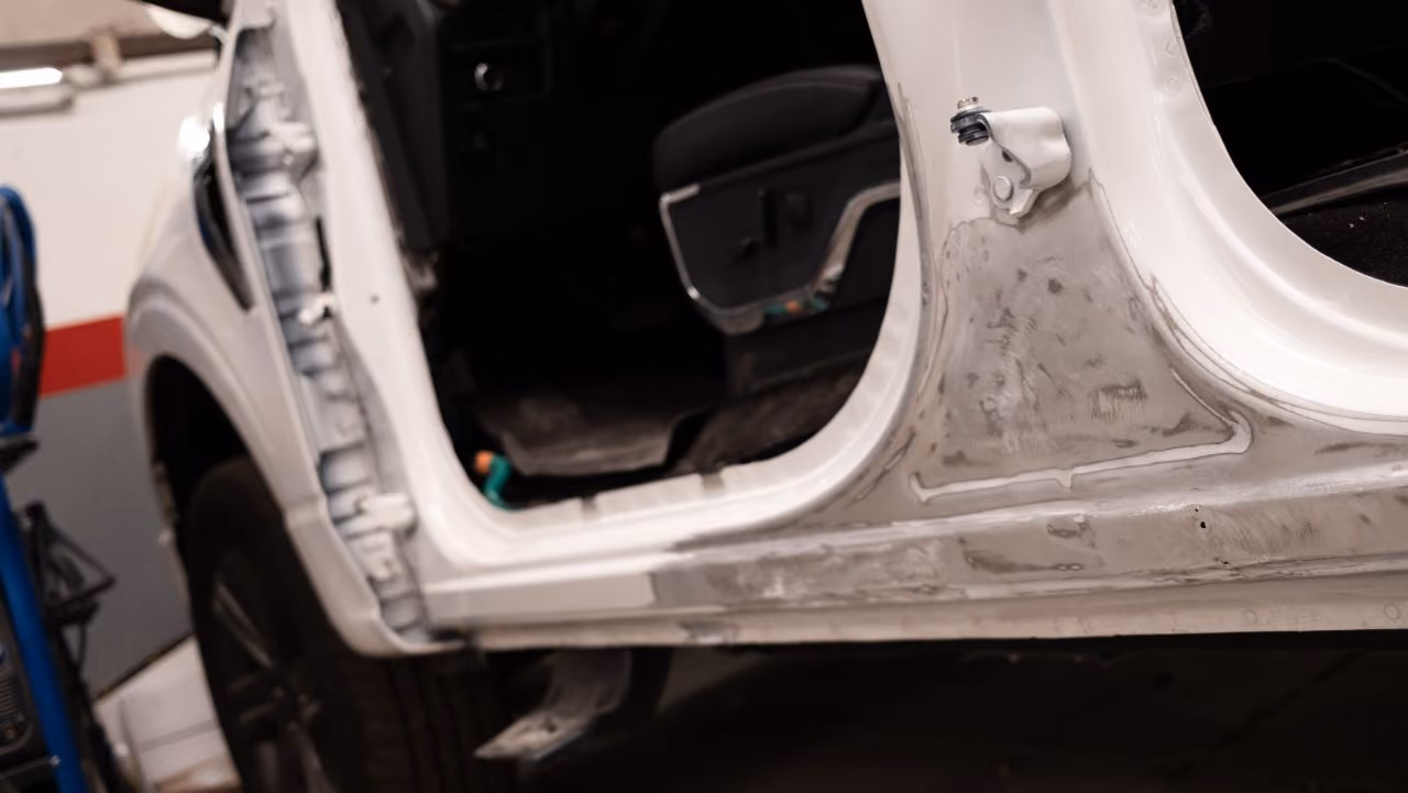 Bare body panel prepped for paint refinishing