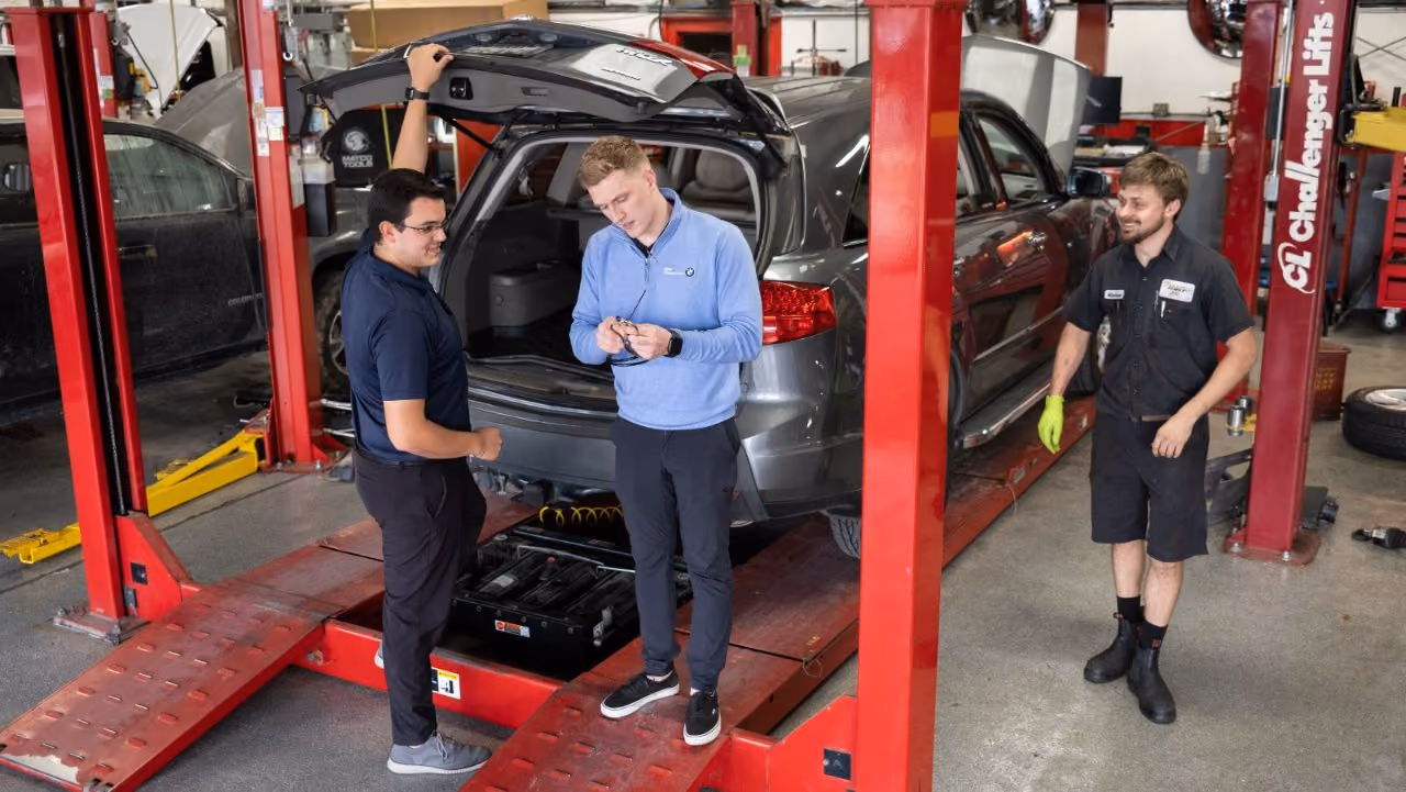 Kenneth's Car Care team in front of the Kingwood, TX collision & mechanical shop