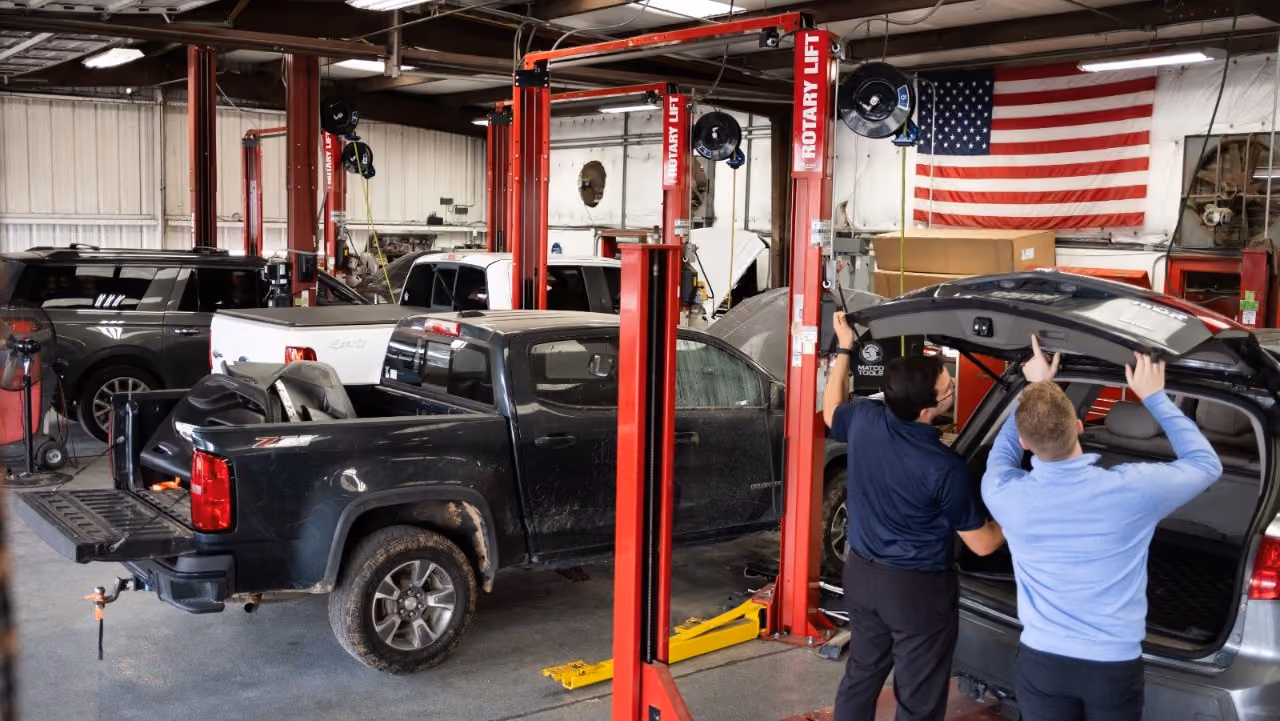 Kenneth's Car Care team in front of the Kingwood, TX collision & mechanical shop