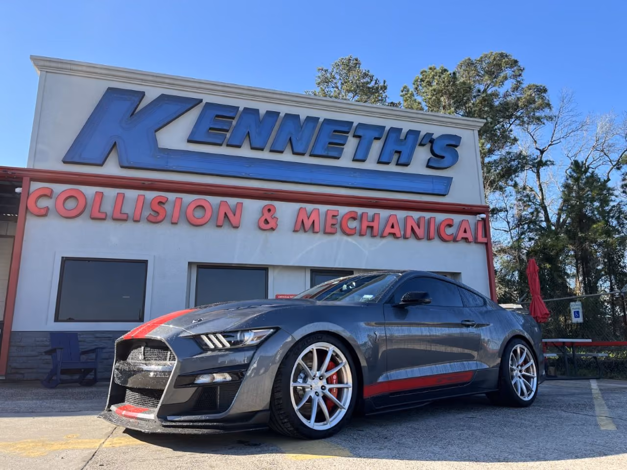Kenneth's Car Care team in front of the Kingwood, TX collision & mechanical shop