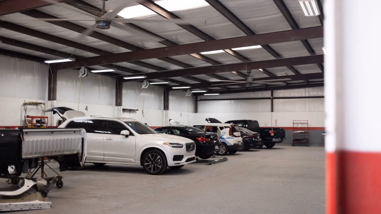 Kenneth's Car Care team in front of the Kingwood, TX collision & mechanical shop