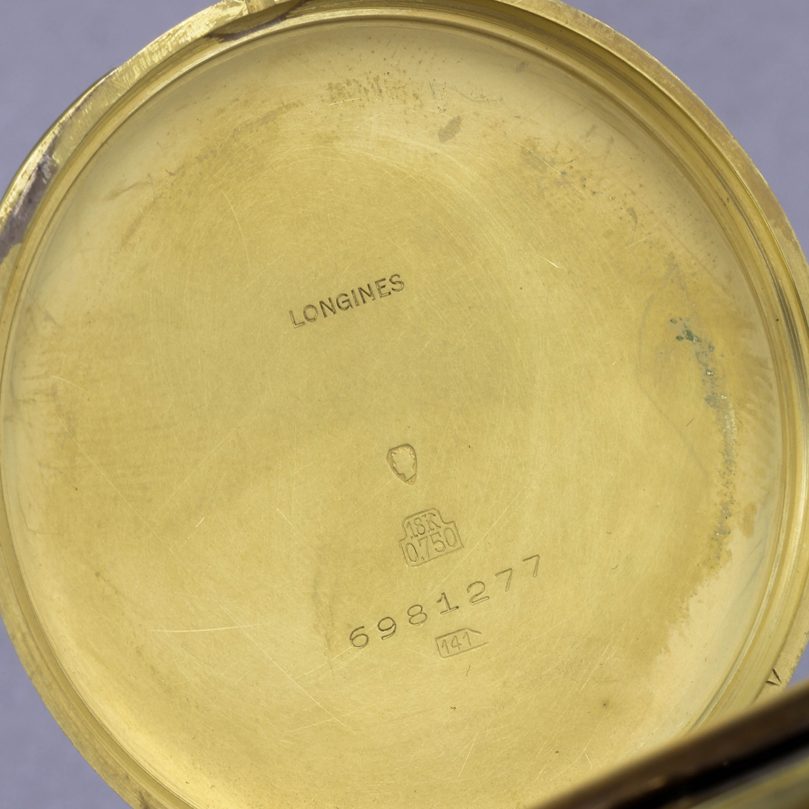 Longines enamel pocket watch cuvette showing the Hammerhead №141 mark