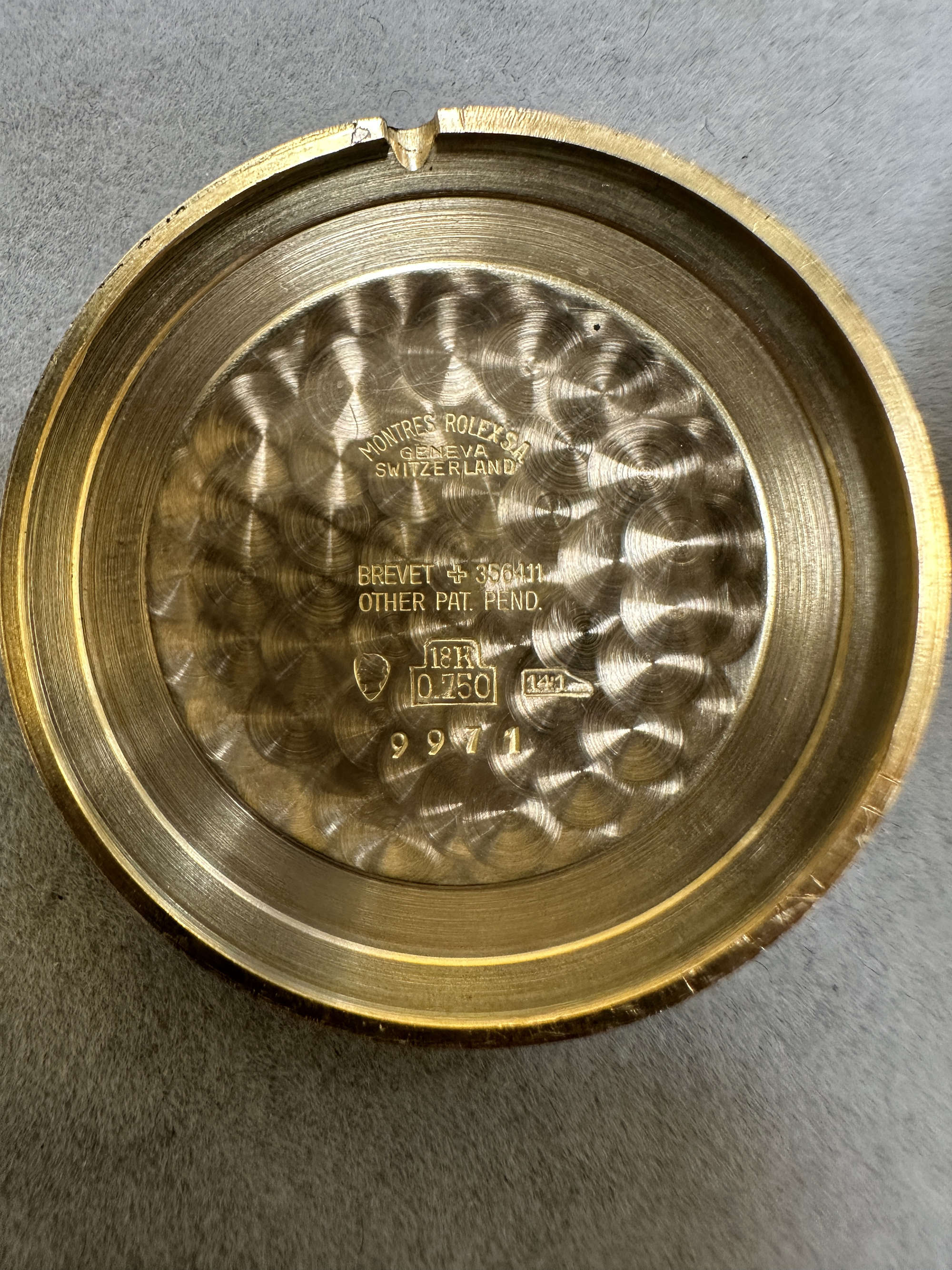 Rolex Precision Ref. 9971 caseback, showing the №141 mark and brevet 356411