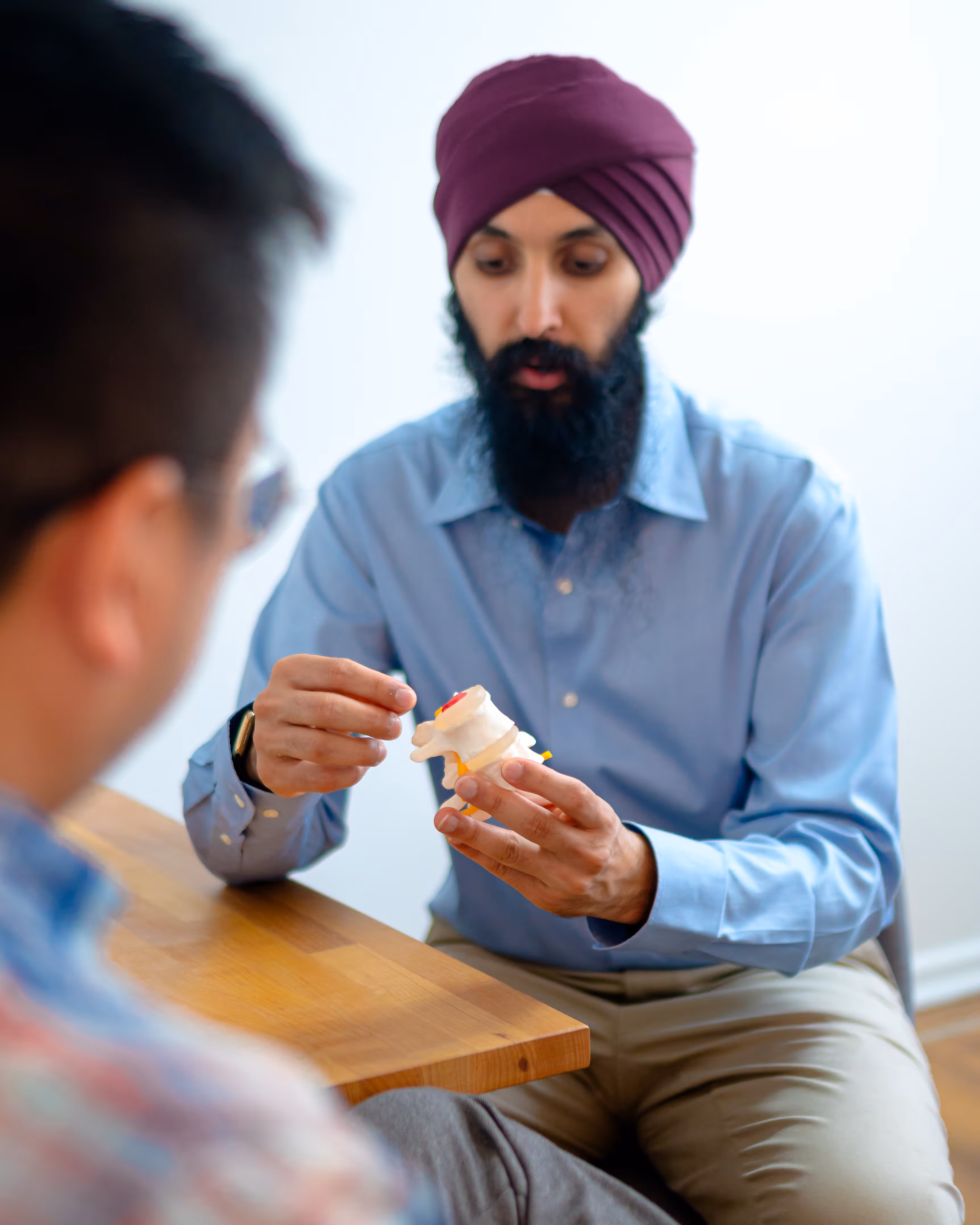 A Back Space clinician explaining assessment findings