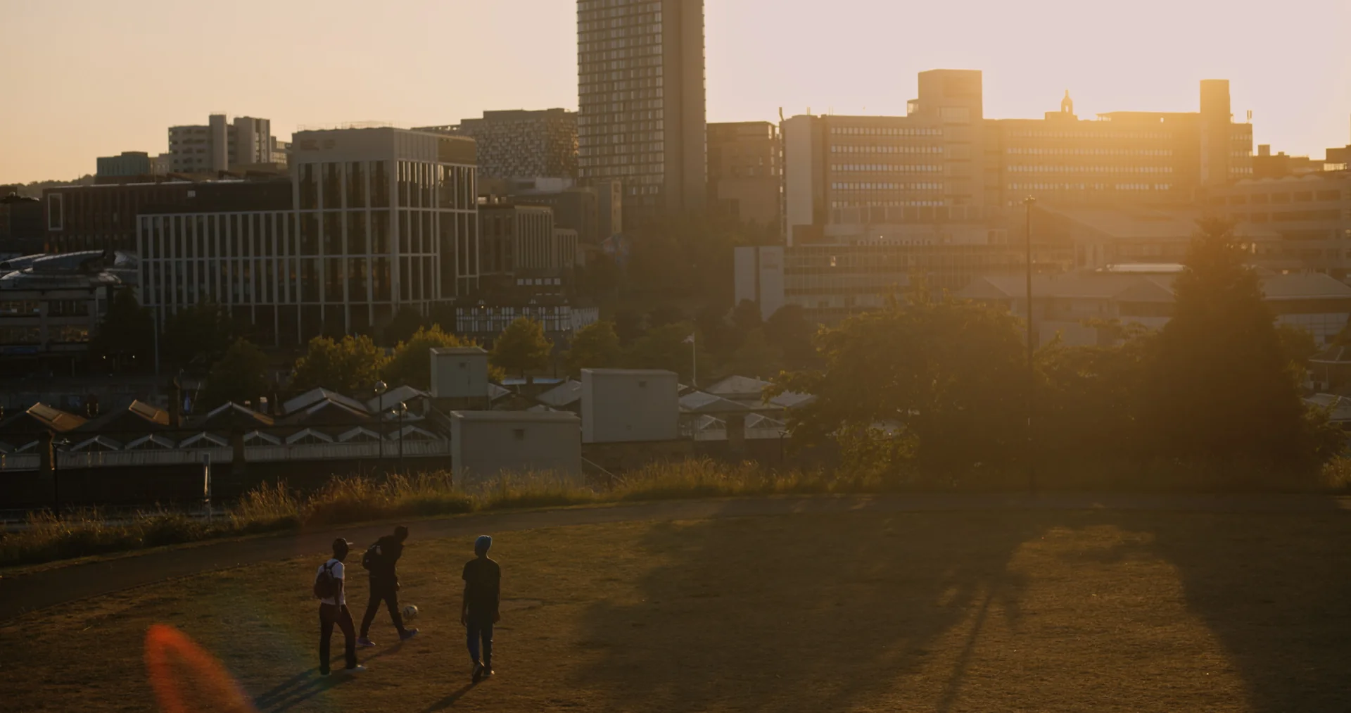Not Yet — Three friends above Sheffield at sunset