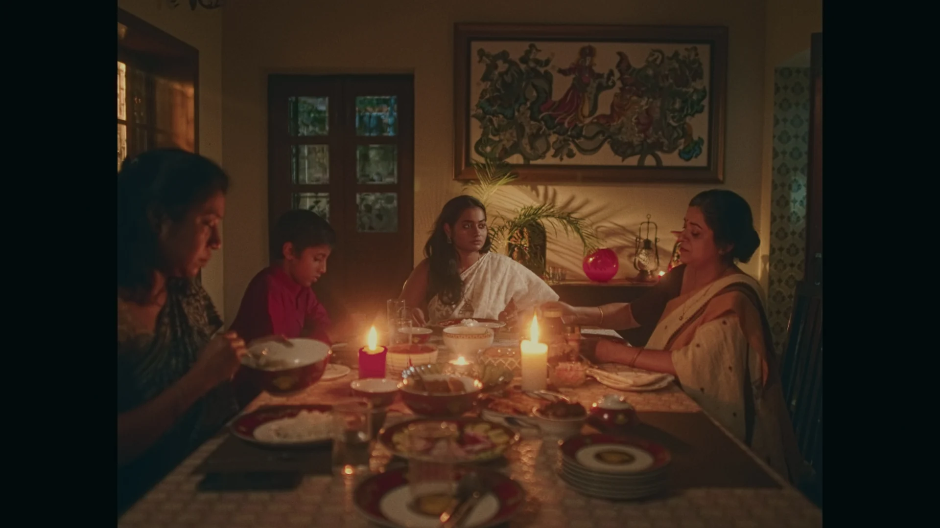 Sweet Tooth — A family gathered around a candlelit dinner table
