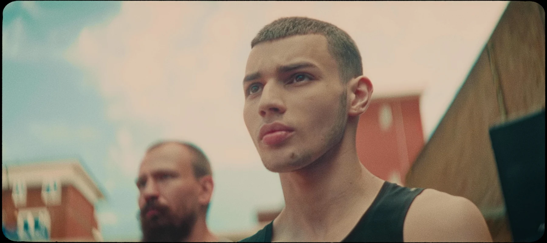 We Move — a young man looking ahead on a London street