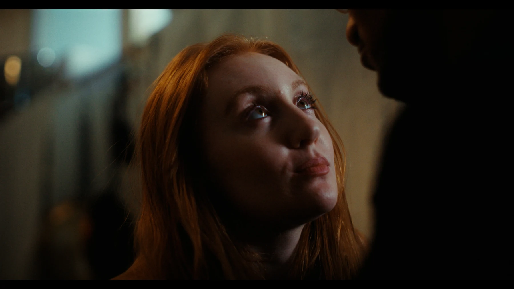 Indispensable — Grace looks up towards Nathan in warm interior light