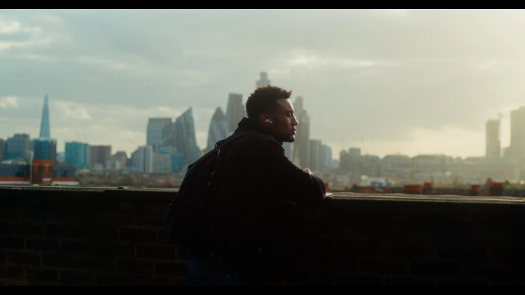 Indispensable — Nathan against the London skyline in late afternoon light