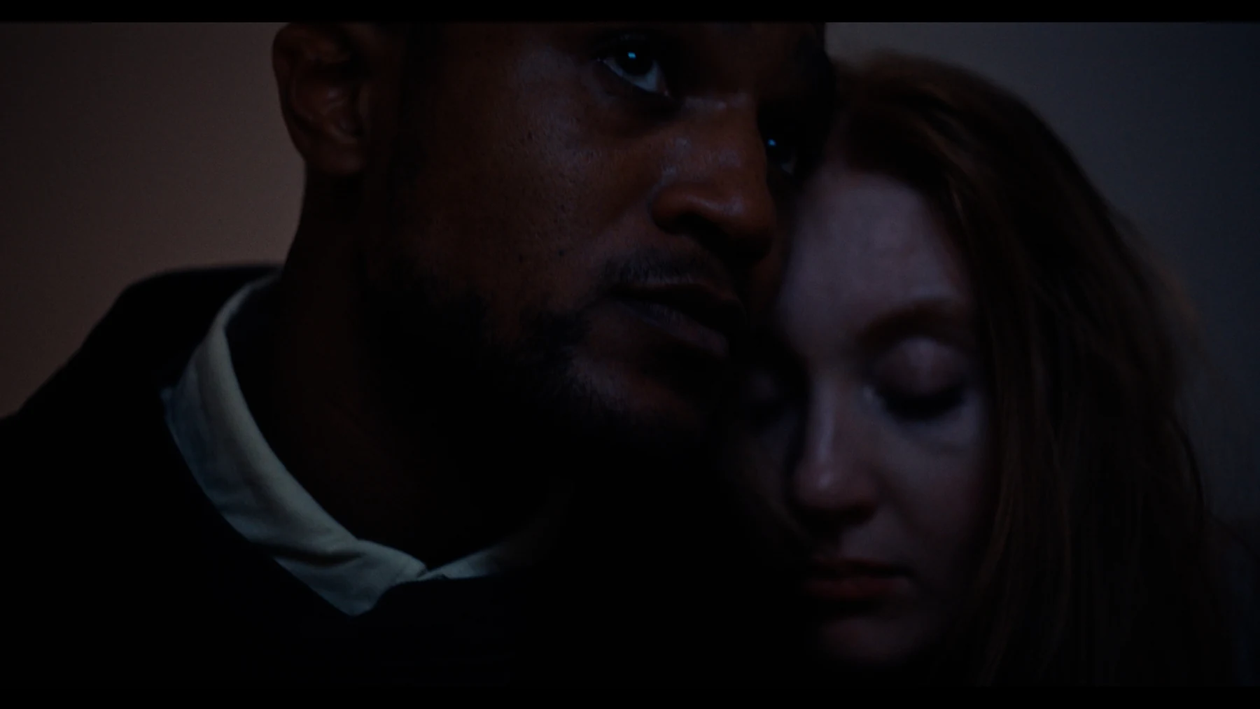 Indispensable — Nathan and Grace hold each other in a quiet, low-lit room