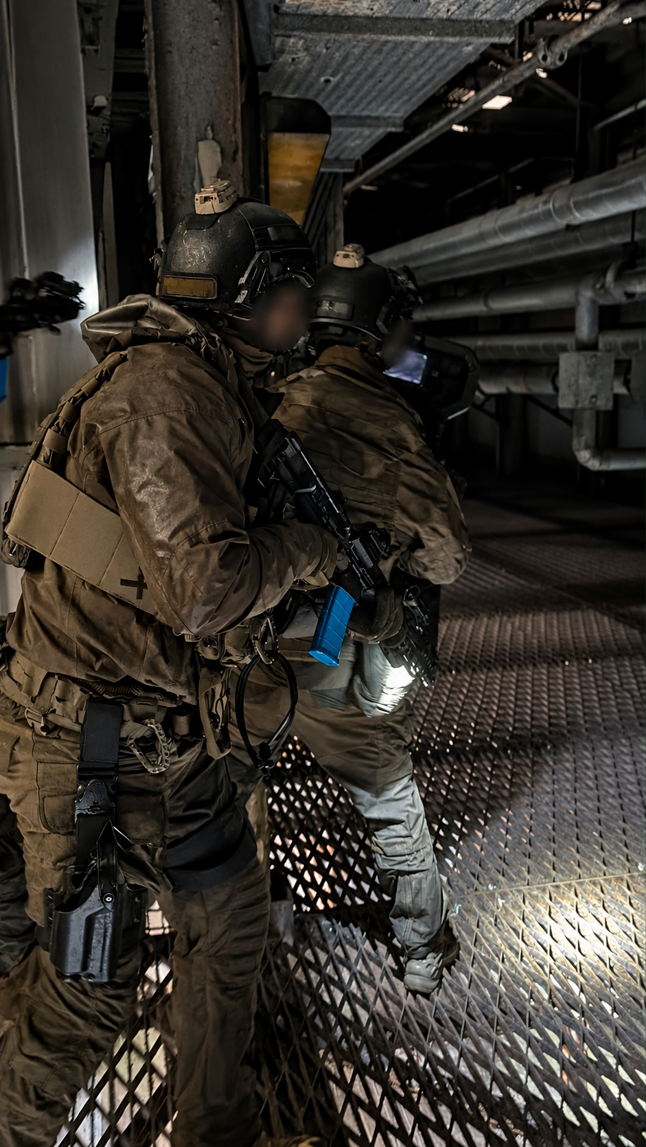 Shield team in a corridor; operator identities obscured