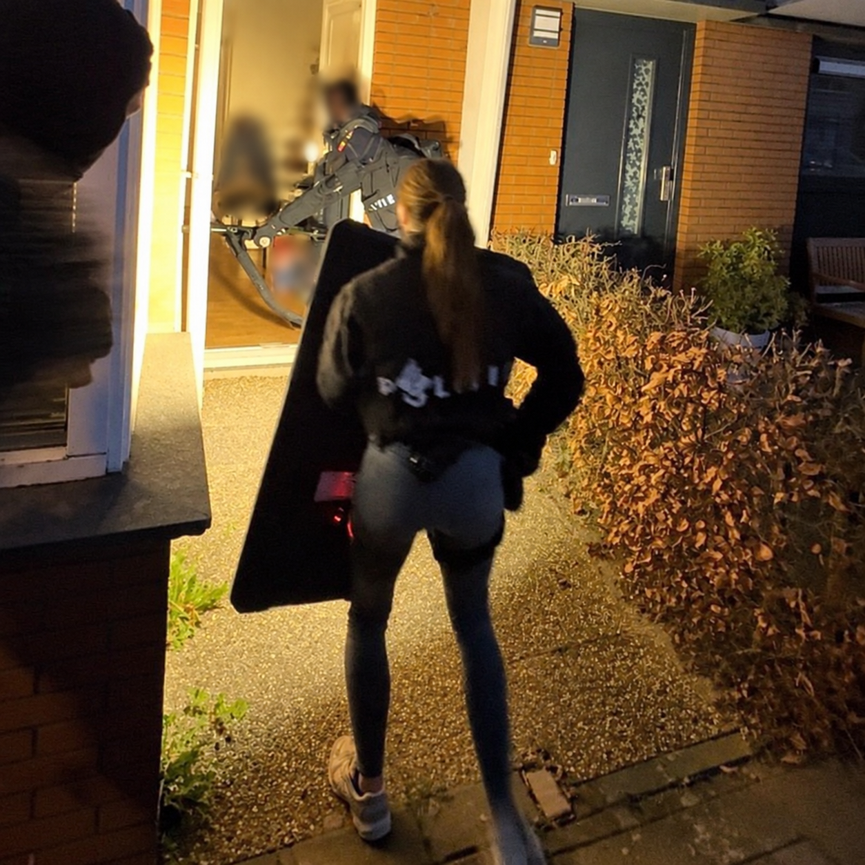 Night entry with PACPROTECT shield; operator identities obscured