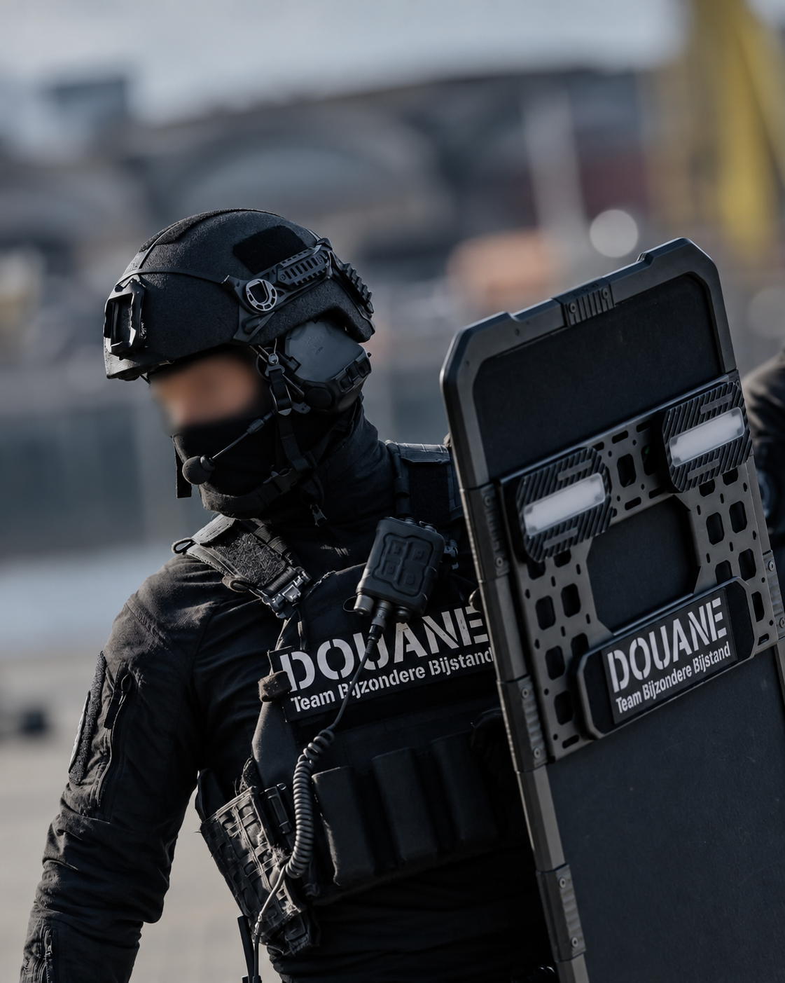 Customs operator with PACPROTECT shield; identity obscured
