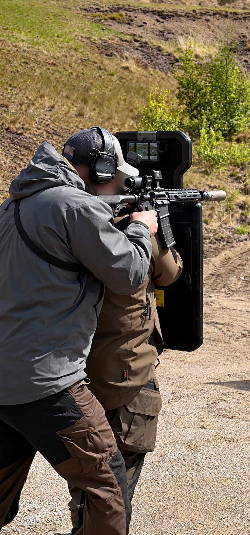 Shield demonstration on a range; operator identities obscured