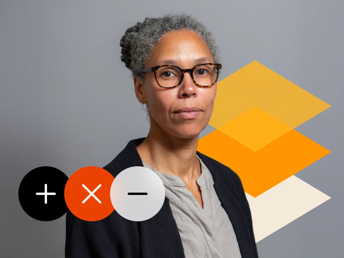 Portrait of a woman with gray curly hair tied back, wearing tortoiseshell glasses, a gray shirt, and a dark cardigan, against a gray background with overlapping orange and beige geometric shapes and three circular icons showing plus, cross, and minus signs.