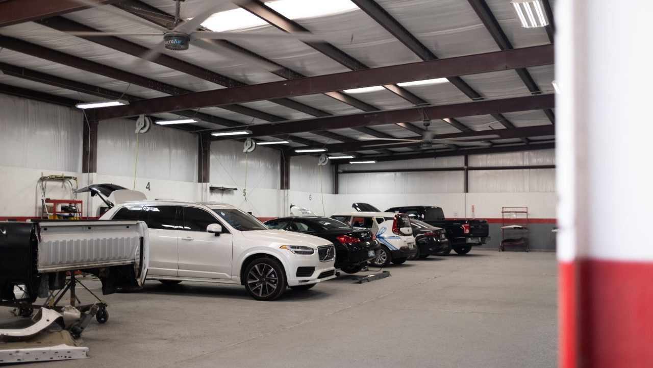 Kenneth's Car Care team in front of the Kingwood, TX collision & mechanical shop