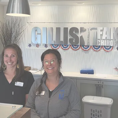 Two smiling Gillis Family Chiropractic staff members