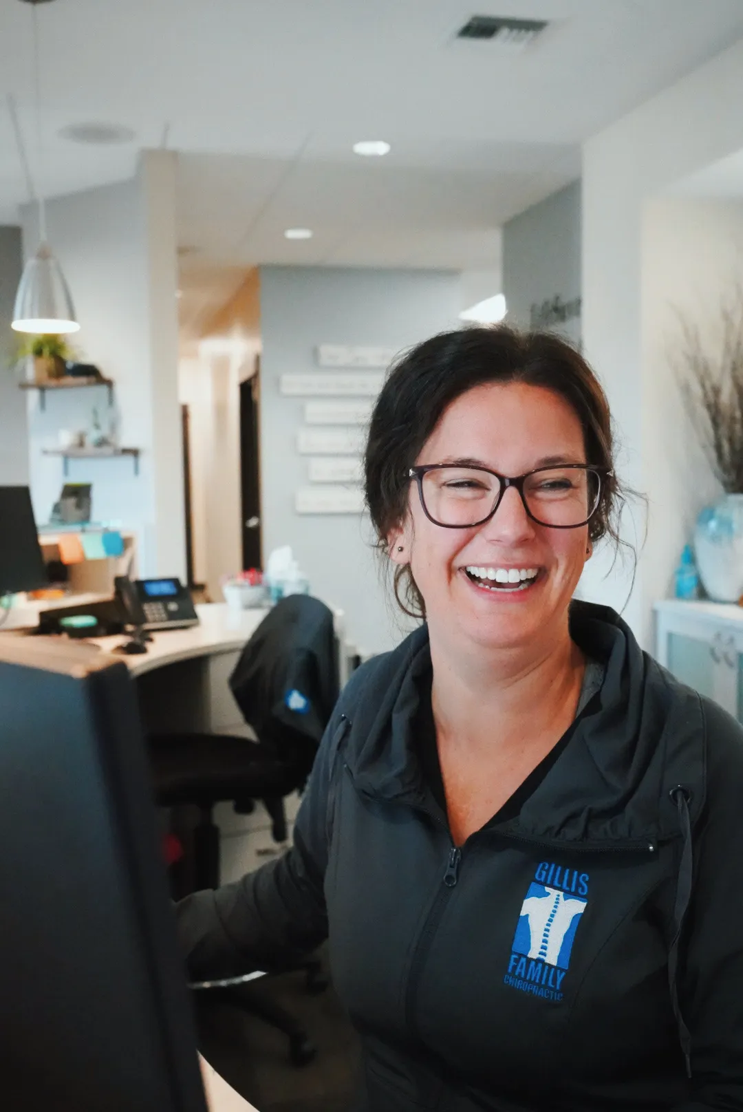 Tammi at the Gillis Family Chiropractic front desk