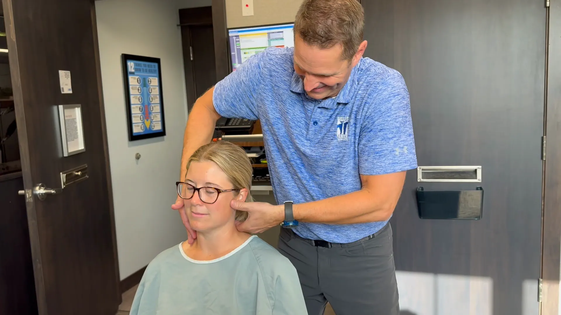 Chiropractor performing a neck adjustment