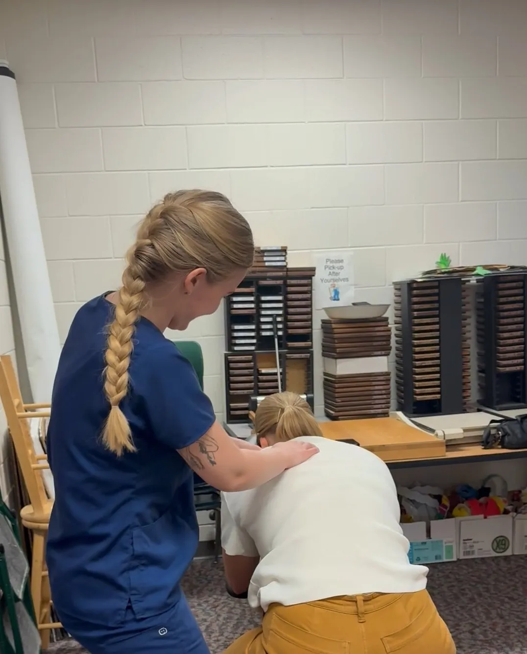 Massage therapist providing a therapeutic massage session