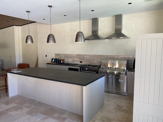 Pendant lights installed above a kitchen island bench