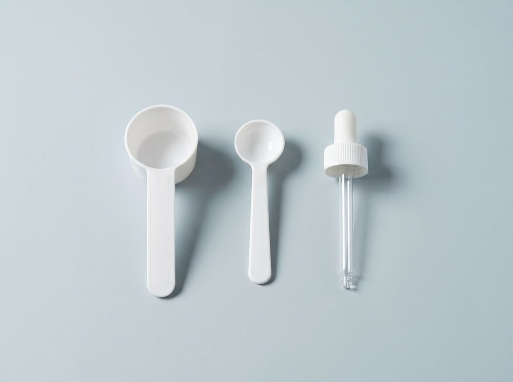 Measuring scoop, dosing spoon and glass pipette