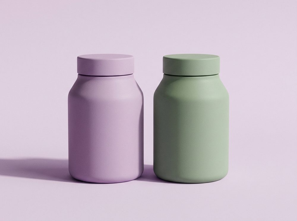 Sculptural custom-moulded supplement bottles in lilac and sage