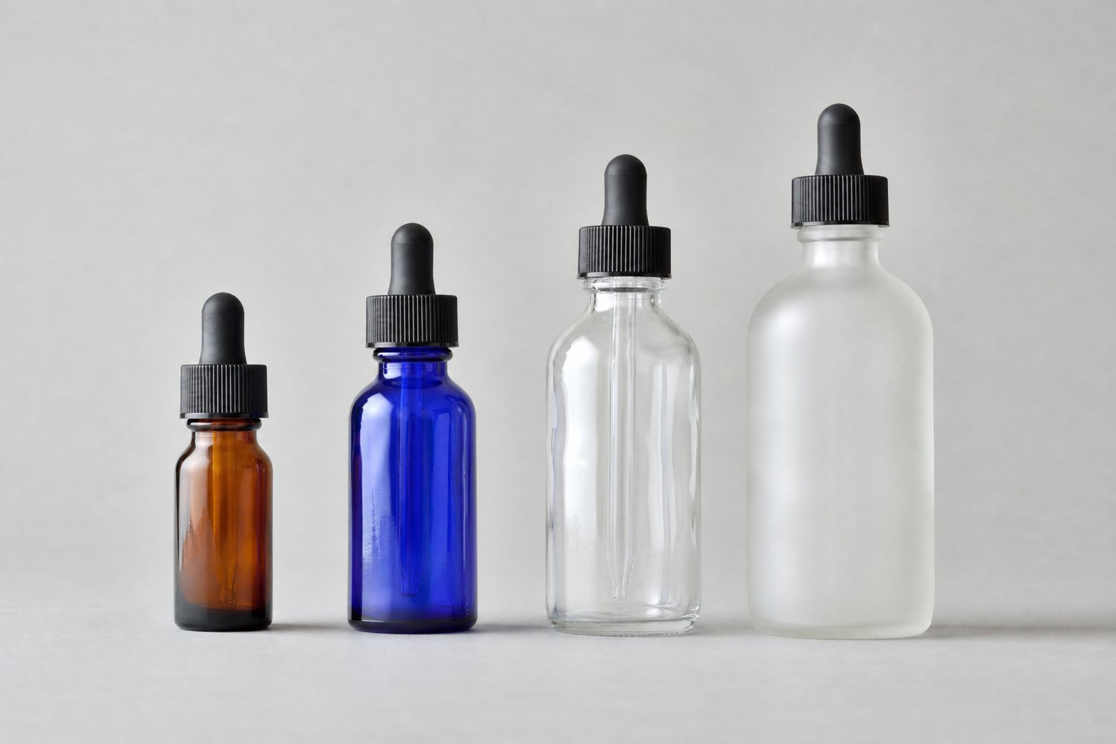 Glass dropper bottles from half an ounce to 4 oz in amber, cobalt, clear and frosted