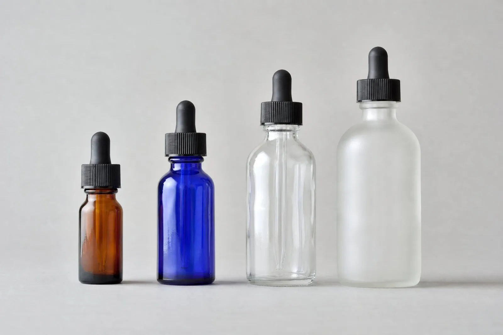 Glass dropper bottles from half an ounce to 4 oz in amber, cobalt, clear and frosted