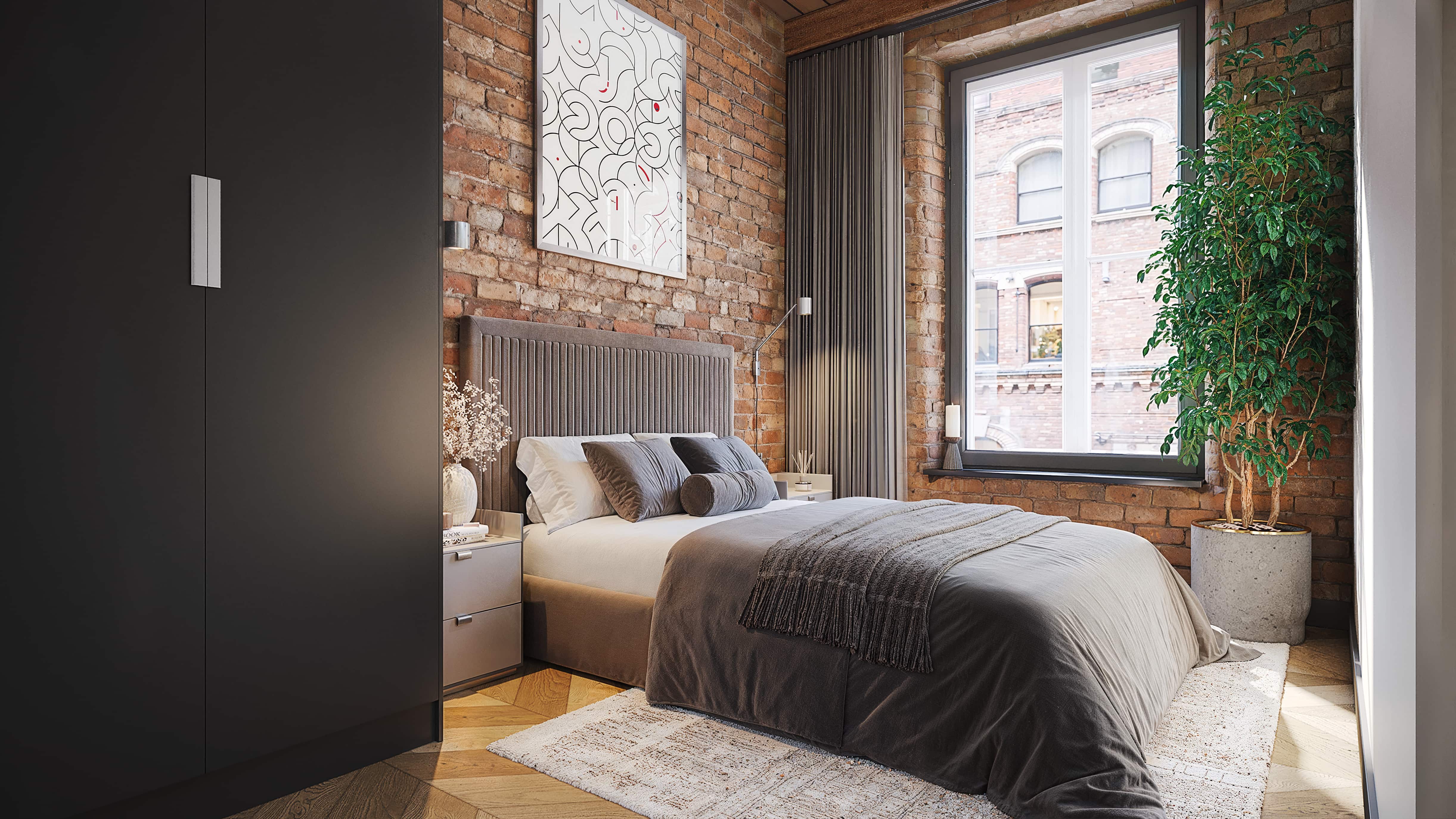 Bedroom within Piccadilly Warehouse showing exposed brick and original window opening
