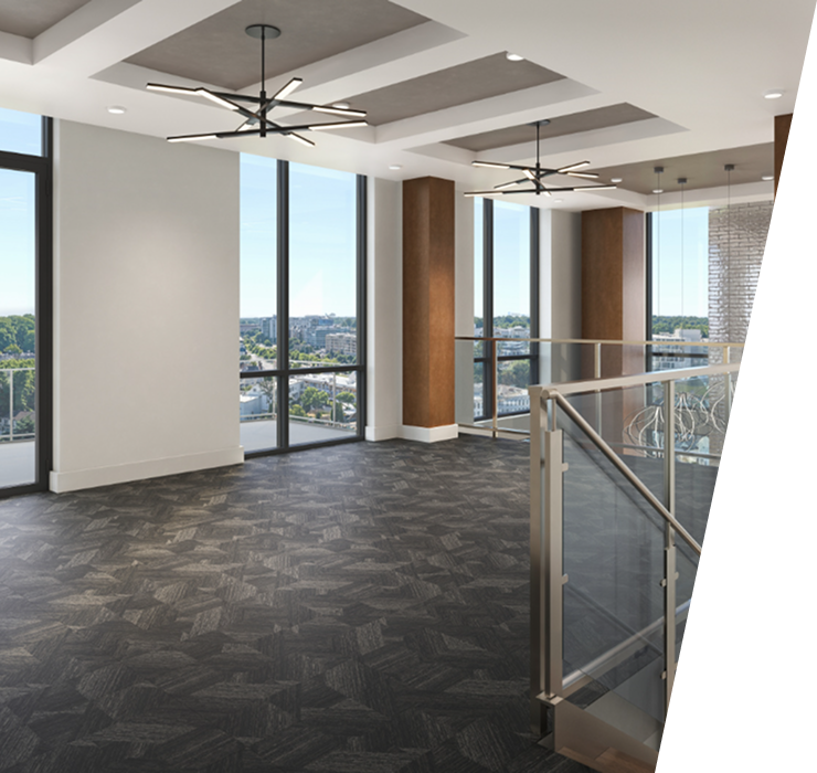 Modern room with dark patterned floor, large windows, hanging lights, and glass railing overlooking lower level.