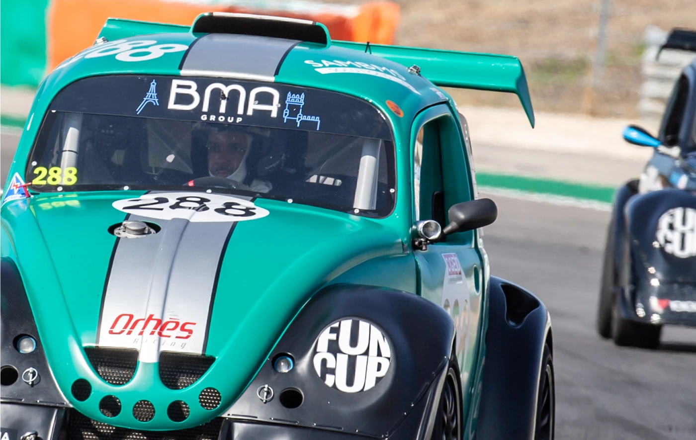 Turquoise Fun Cup race car with BMA Group branding on a circuit