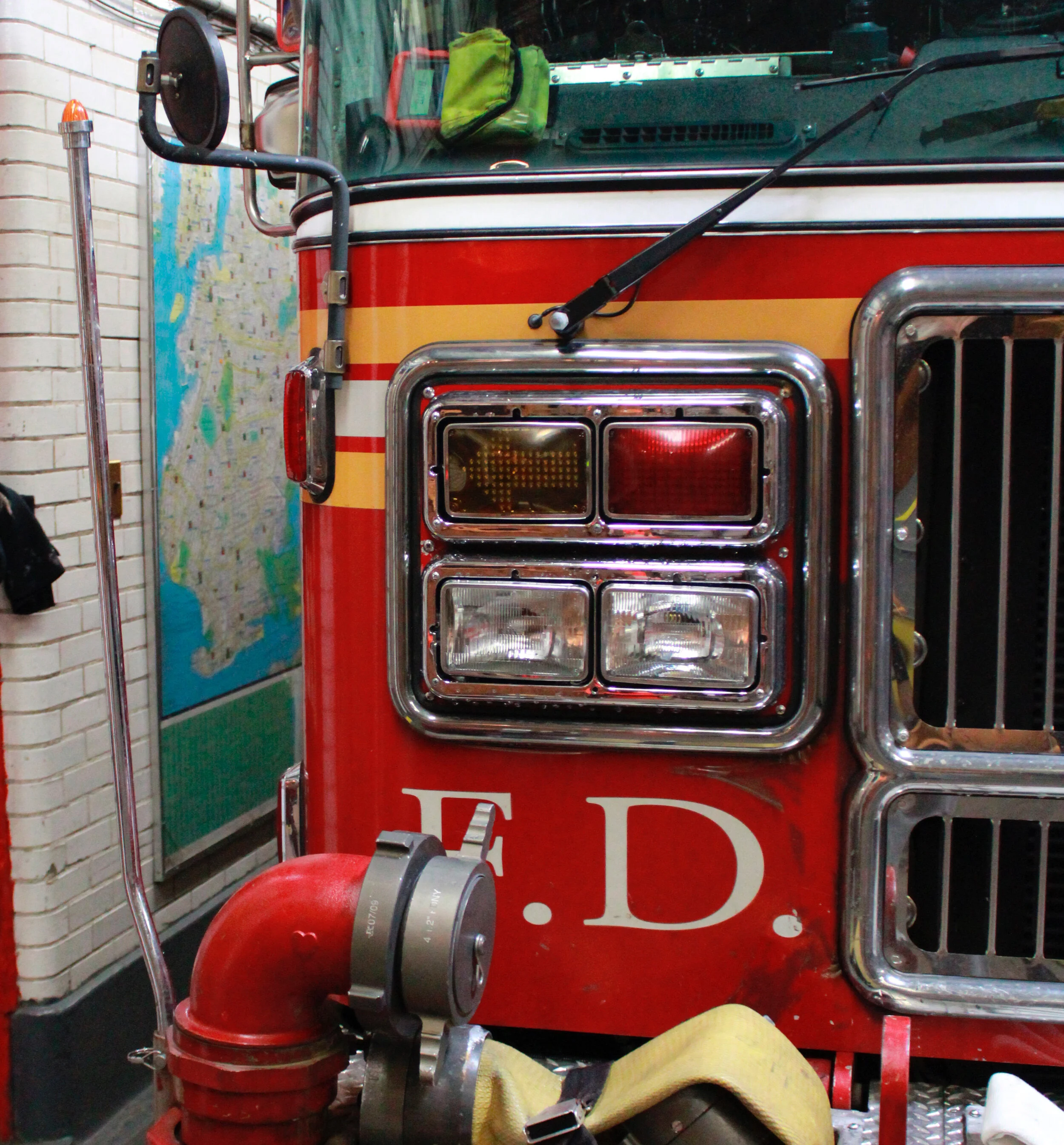 FDNY fire truck parked inside a firehouse bay