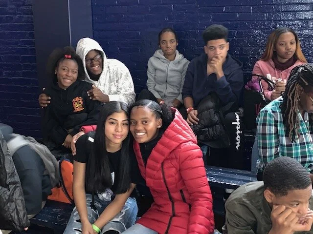 Students gathered together smiling during a school event