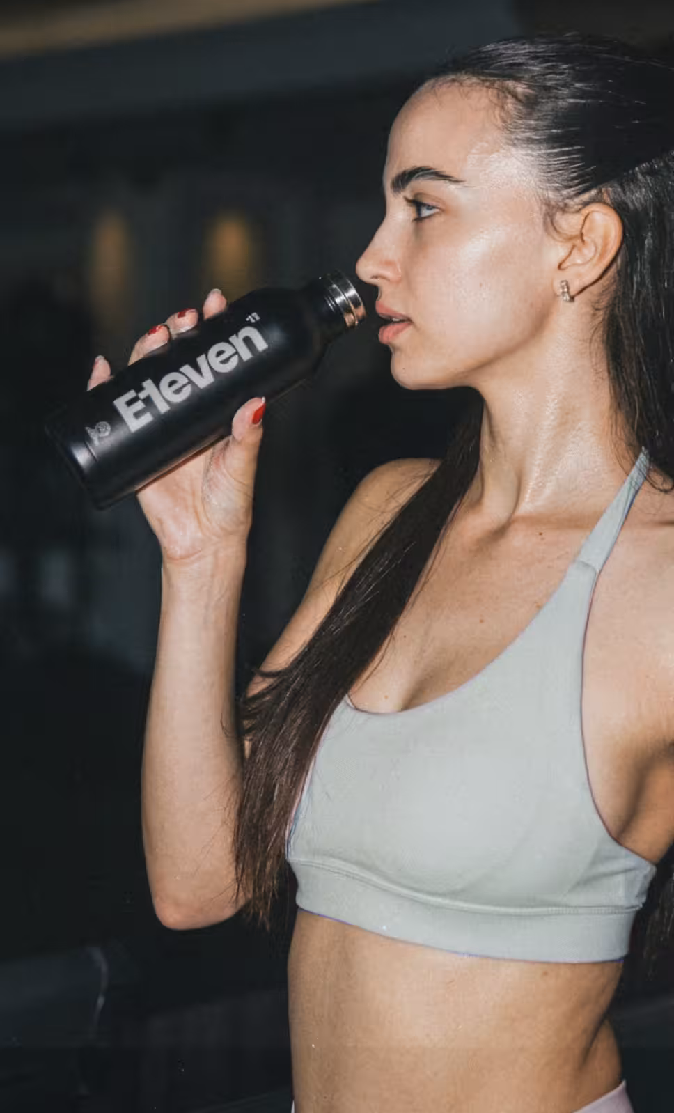 Woman using a bottle of water