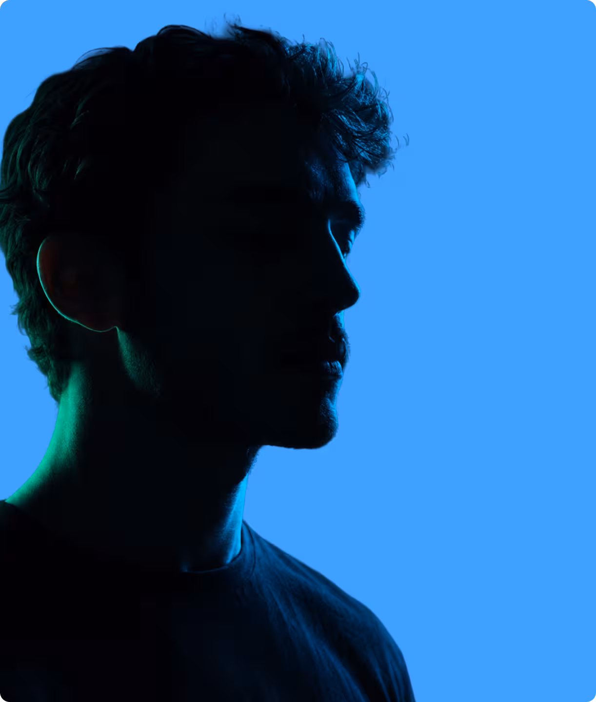Silhouette portrait against a blue background