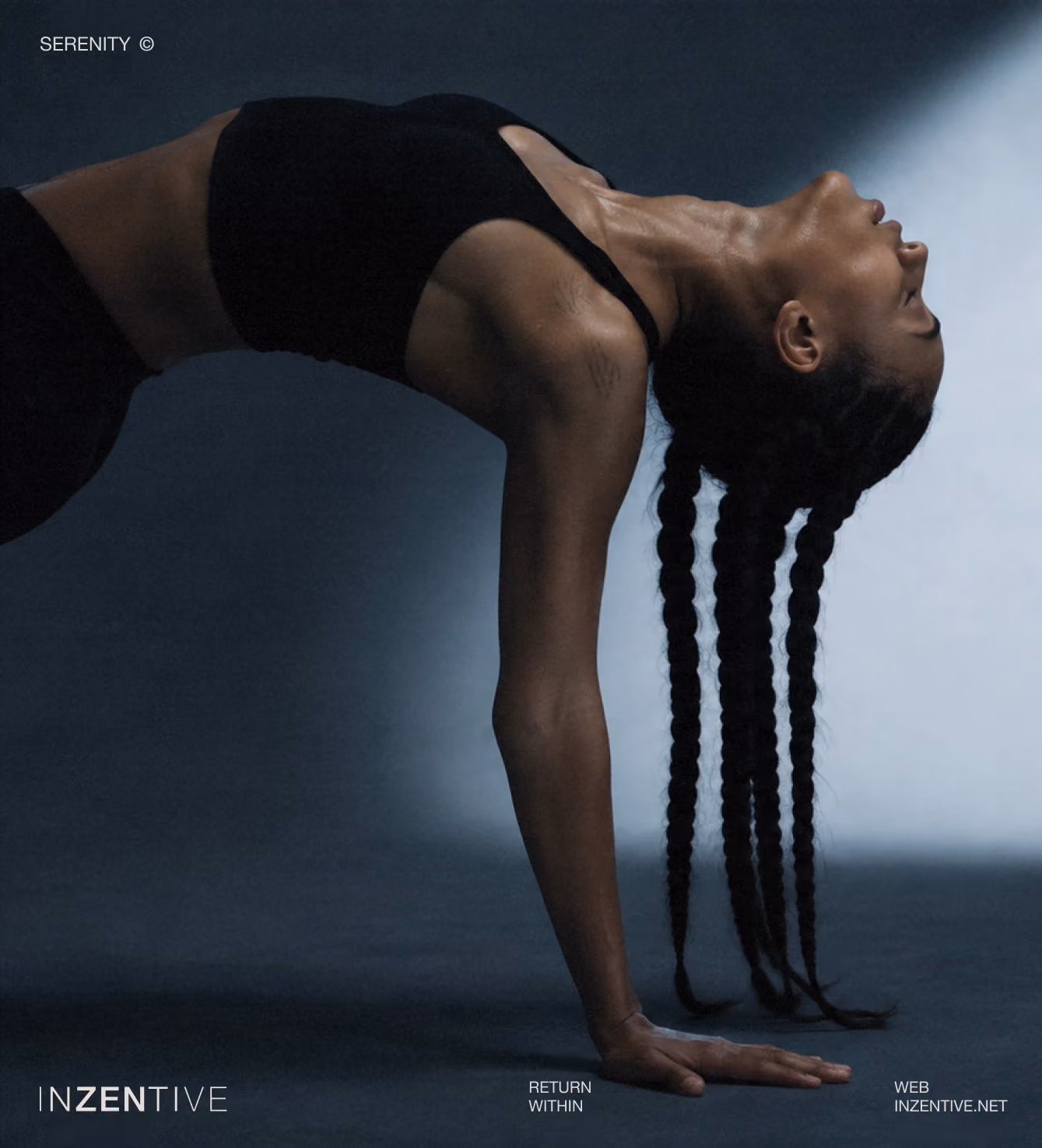 Woman in a black bridge yoga pose lit dramatically against a dark blue background.