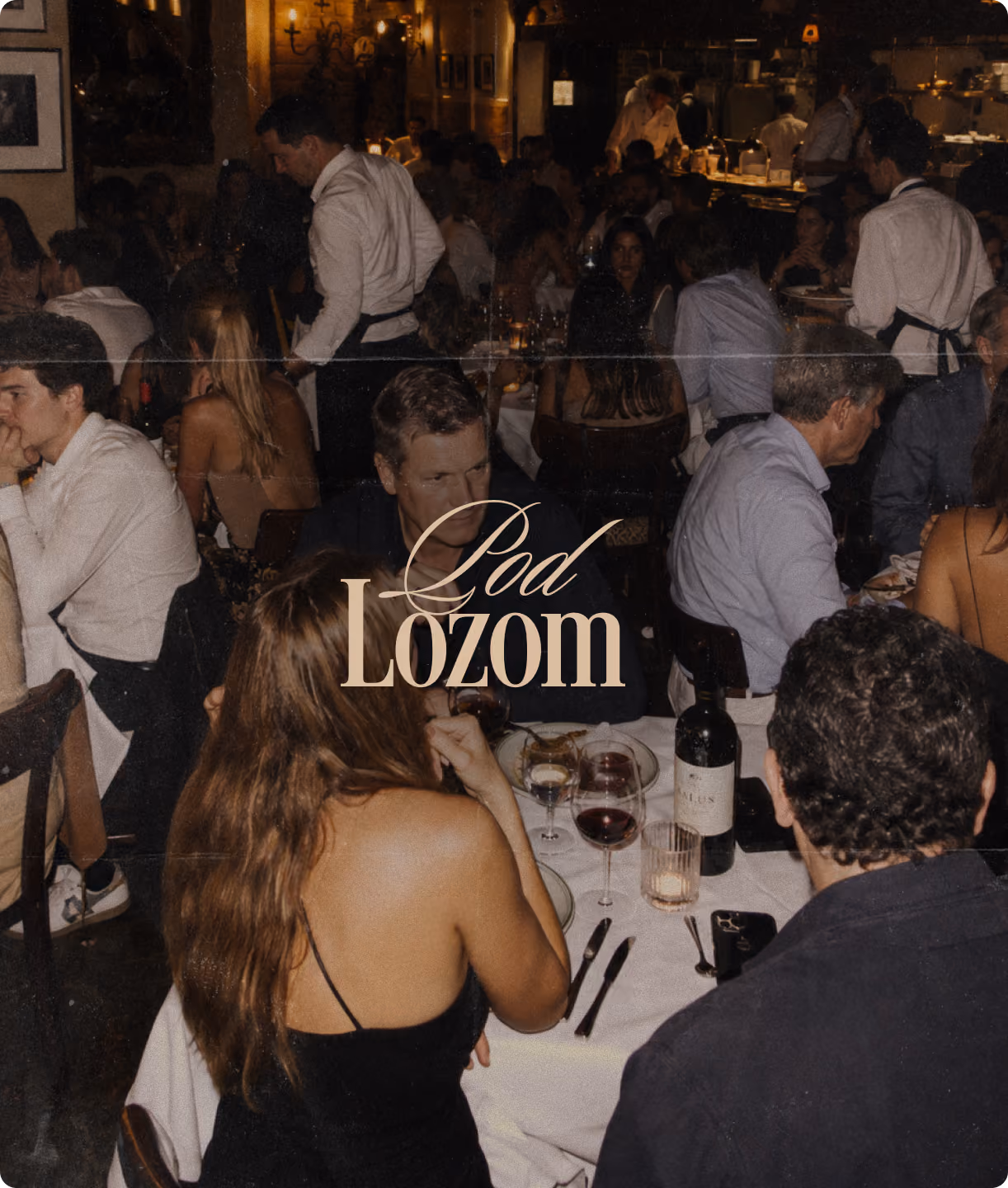 Restaurant dining scene with the Pod Lozom logo overlay.