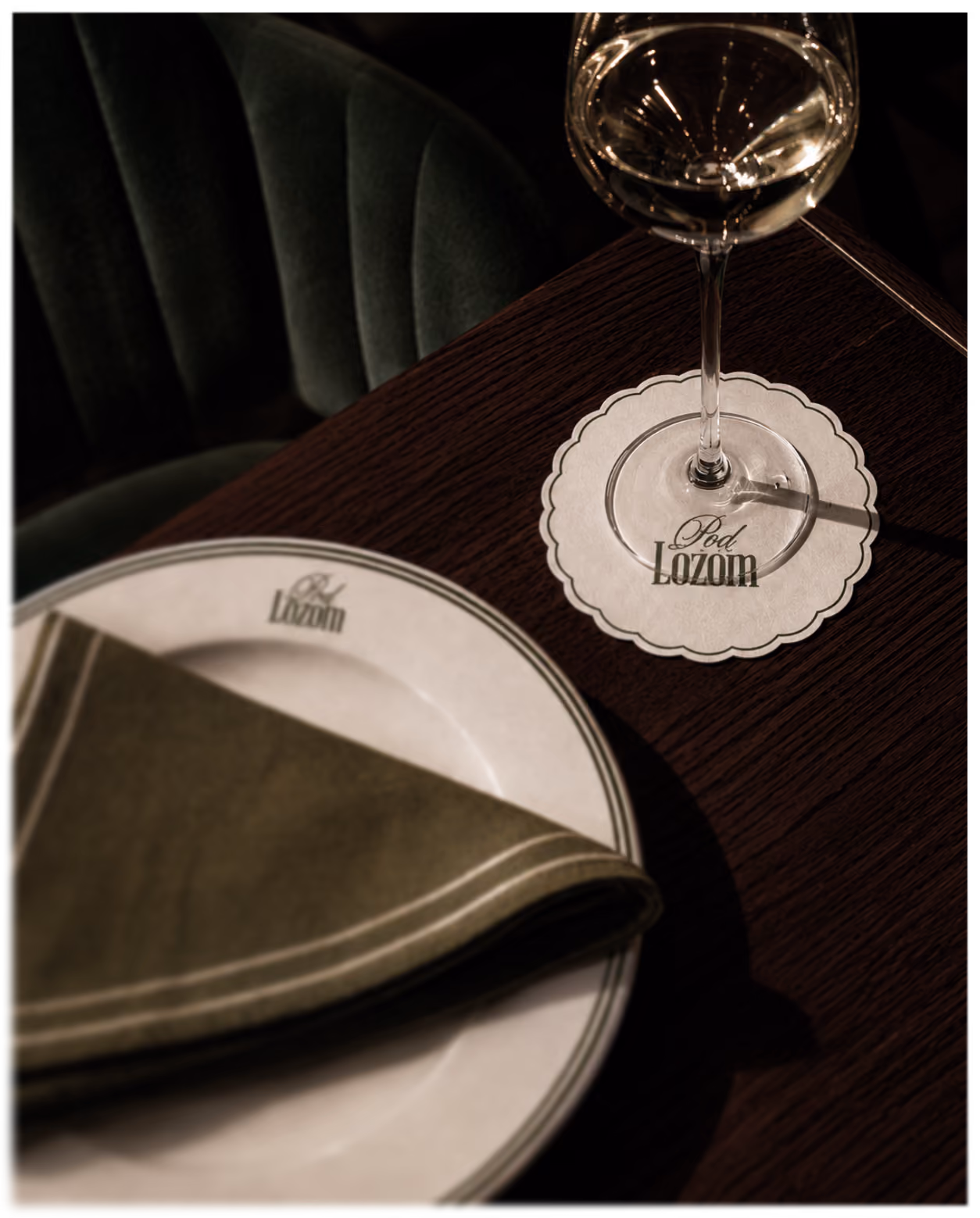 Table setting with Pod Lozom plate, napkin, and coaster.